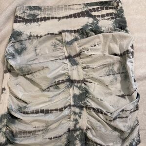 Pull on ruched skirt. Sits right above knee.